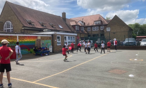 Children playing sport in the playground